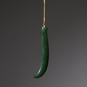 A stunning pounamu kapeu (ear pendant), in rich, gem grade…