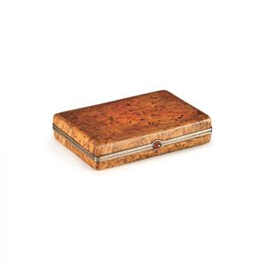 A Faberge cigarette case in Karelian birch mounted in…