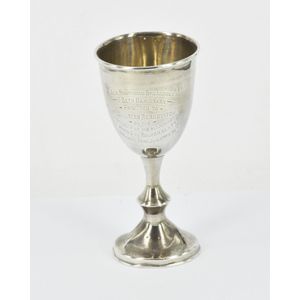 A sterling silver Jewish cup, raised on circular foot, engraved…