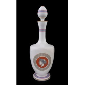 An antique French milk glass decanter with neo-classical…