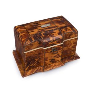 An antique Georgian tea caddy, tortoiseshell inlaid with silver,…