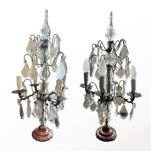 A pair of classically styled 4 branch table chandeliers. Tear…