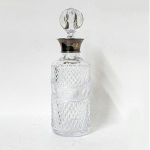 A good silver mounted hobnail cut spirits decanter, of circular…