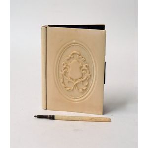A Victorian ivory covered card case, the front with oval…