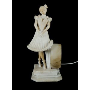 Alabaster figural lamp, young woman standing next to a drum,…