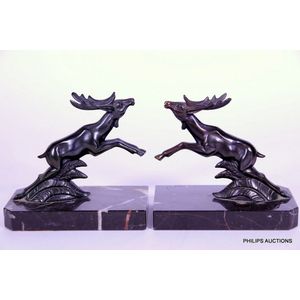 A pair of Art Deco stag spelter bookends, circa 1930, leaping…