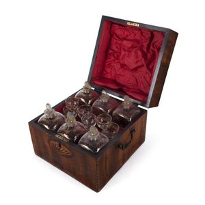 A Georgian six bottle decanter set in inlaid mahogany case,…