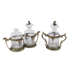A French decanter set in gilt bronze stands, 19th century, 24…