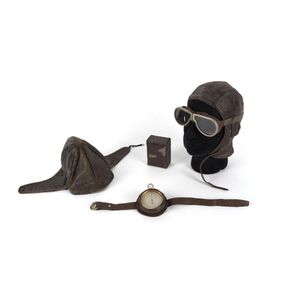 Aviation: two leather pilots caps, googles in case and arm band…