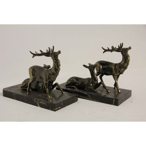 A pair of French Art Deco deer bookends on rectangular marble…