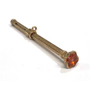 A gold lined, orange glass seal top propelling pencil, ridged…