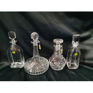Four decanters. Including crystal ships decanter, three ringed…