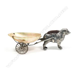 An uncommon Edwardian silver dog and cart pin cushion and…