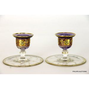 A pair of Bohemian glass candlesticks, 20th century, the pair…
