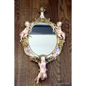 An Italian porcelain cherubs wall mirror, Kings Capodimonte,…