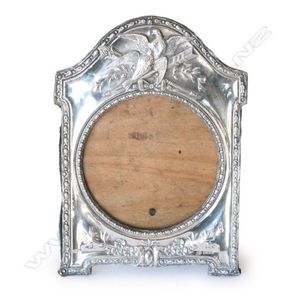 A late Victorian silver photo frame, gadrooned border with pair…