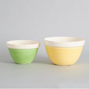 A pair of Crown Lynn mixing bowls, the larger in yellow, the&hellip;
