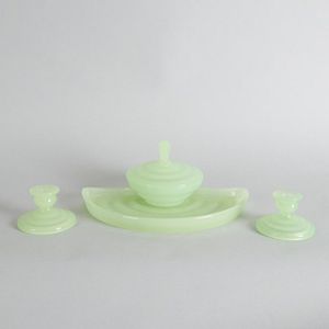 A uranium glass dressing table set, comprises a fan shaped tray,…