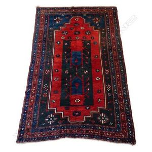 A fine hand knotted Bokhara rug, the field decorated with a…
