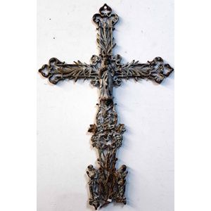 A Victorian cast iron crucifix, of leaf and grape form, centred…