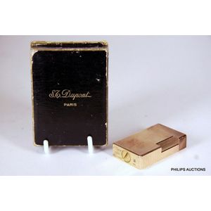 A vintage gold plated lighter by S.T Dupont of Paris, mid 20th…
