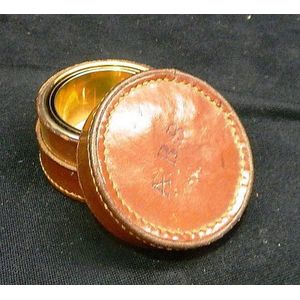 A silver plated, gilt lined beaker in leather case lid…