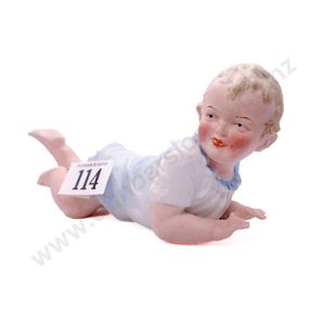 German all bisque piano baby, all painted and moulded with…
