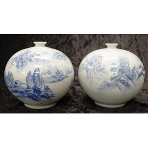 Pair of Japanese blue & white vases, both decorated with…