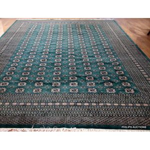 A Pakistani Bokhara wool rug, late 20th century, the soft…