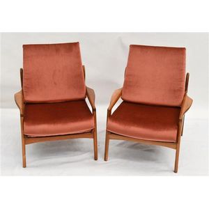 A pair of Parker style upholstered armchairs in salmon…