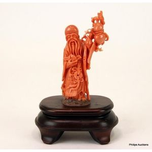 A Chinese carved red coral figure of Shou Lao on stand, 20th&hellip;