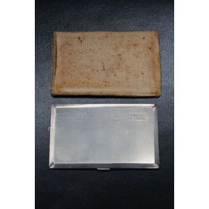 A mid 20th century engine turned cigarette case with gilt…