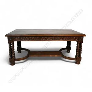 An impressive oak dining table, the top with decorative carved&hellip;