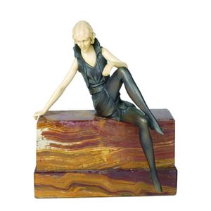 A vintage Art Deco style figurine, in the manner of Chiparus, a…