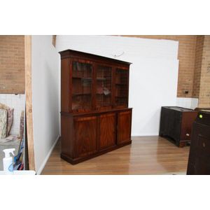A fine flame mahogany three door library bookcase, having&hellip;