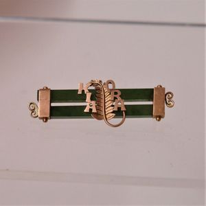 A New Zealand made Harrop & Neill 9ct. rose gold and double…