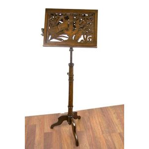 A late Victorian carved wooden music stand, the music stand…