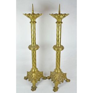 Lot - A PAIR OF ECCLESIASTICAL GOTHIC REVIVAL GILT BRASS PRICKET  CANDLESTICKS, ENGLISH, SECOND HALF 19TH CENTURY