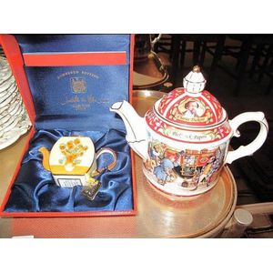 Boxed enamel teapot with a Saddler Pickwick papers porcelain…