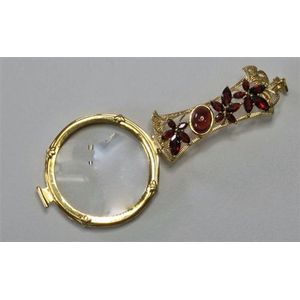 A silver gilt folding Lorgnette; handle set with mixed cut…