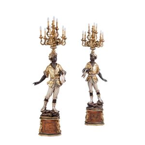 A pair of gilt-wood blackamoor nine-branch candelabras,…