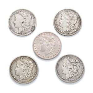 Five US silver Morgan dollar coins, 2 X 1883, 1884, 1891, 1899,…
