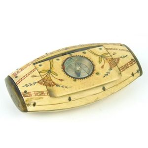 An unusual carved horn oval snuff-box inlaid with a compass,…