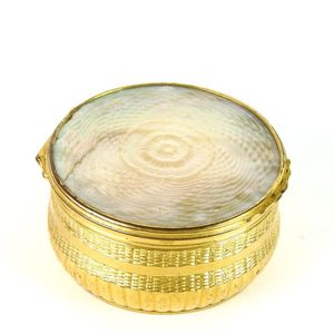 A carved mother of pearl flower head pattern and gilt bronze…