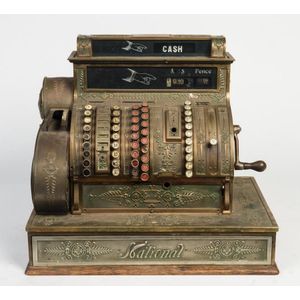 An 'International' antique American brass cash register.…