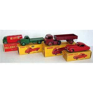 Four Dinky Toys including: 157 Jaguar XK120 Coupe red, 421…