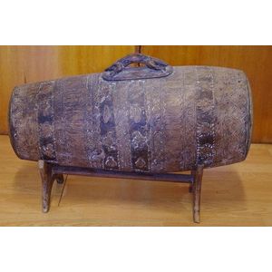 Native Borneo carved storage canister on stand, 58 cm wide