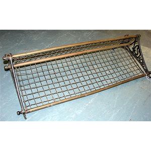 An original cast iron and brass NSW Railways Luggage rack