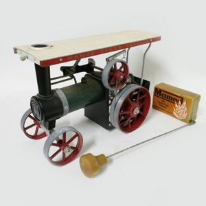 A Mamod steam tractor, in original box with steering extension,…