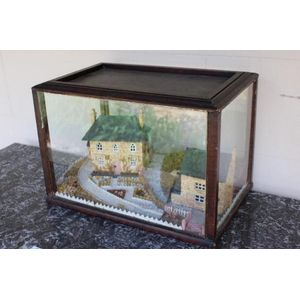 Antique diorama view of mill cottage and water wheel, in a…
